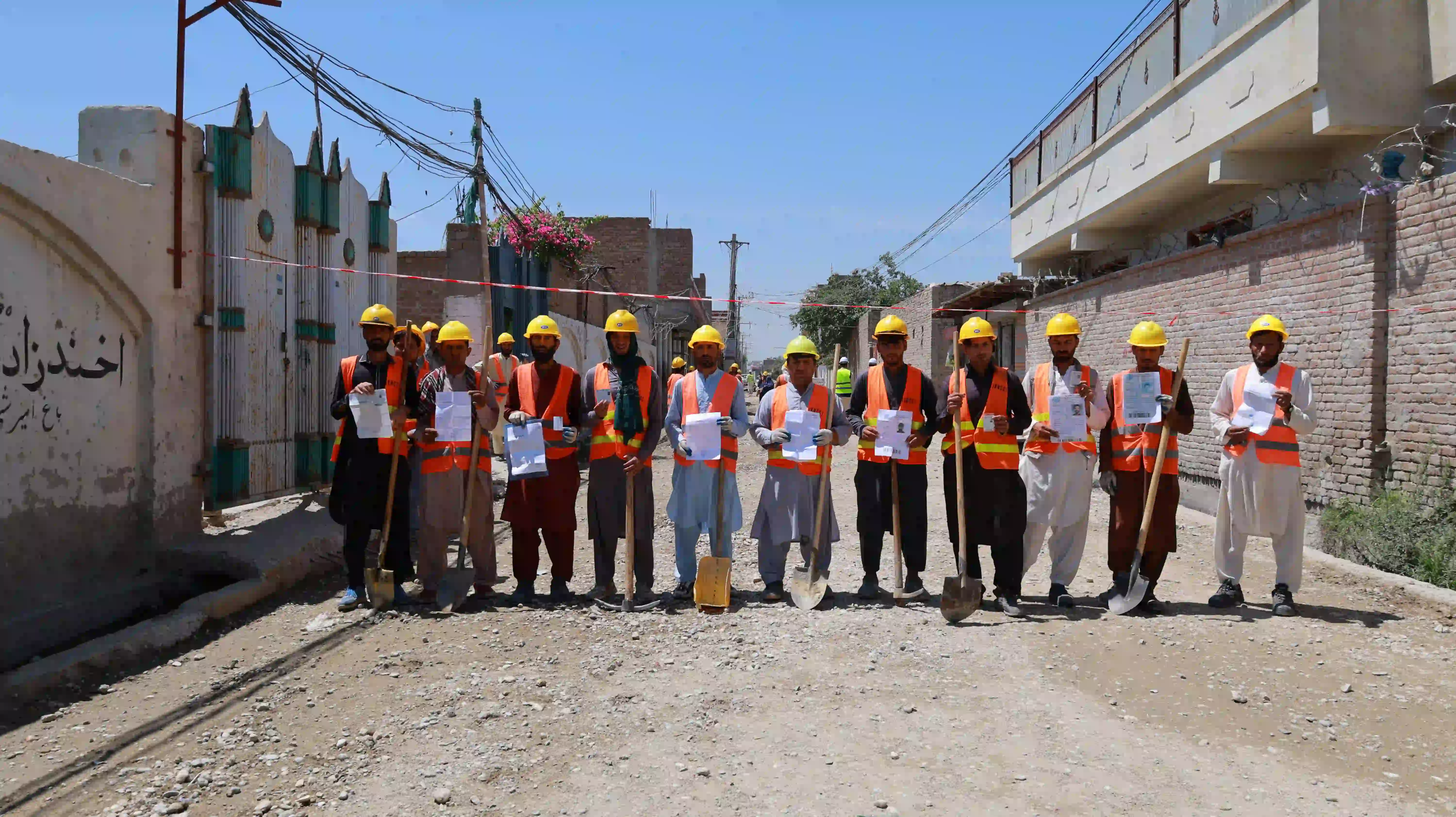 RETURNEES WORKING ON THE UPGRADING OF PLUM CONCRETE SURFACE STREETS WITH A TOTAL LENGTH OF 570M IN GOZAR 7 DISTRICT 9 OF JALALABAD CITY