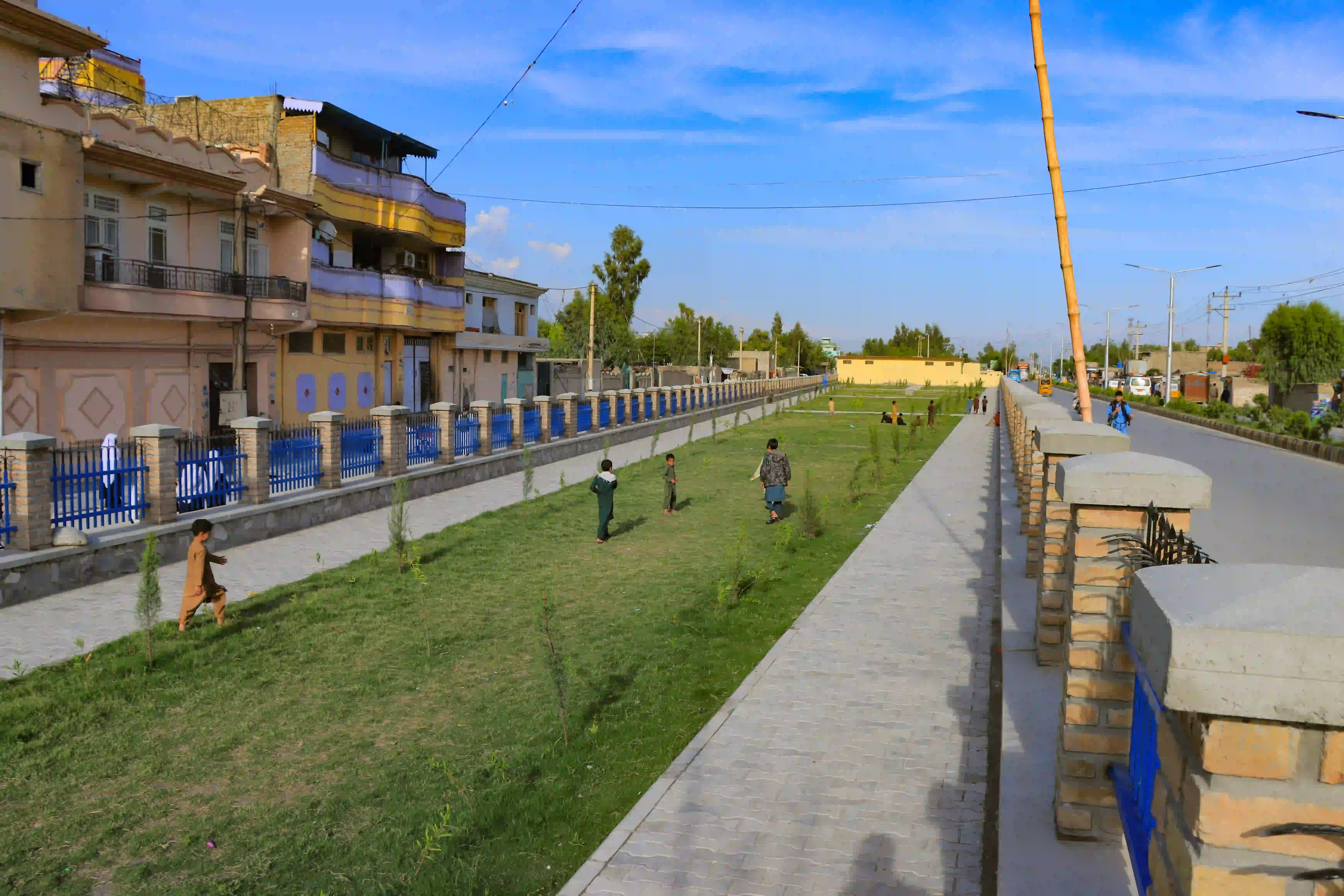 CHILDREN BENEFITING FROM THE COMPLETED CONSTRUCTION AND REHABILITATION OF THE PARK BOUNDARY WALL AND PLUM CONCRETE SURFACE ROAD BY THE CRL PROJECT IN DISTRICT-4, NANGARHAR PROVINCE